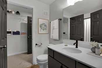 a bathroom with a walk-in closet